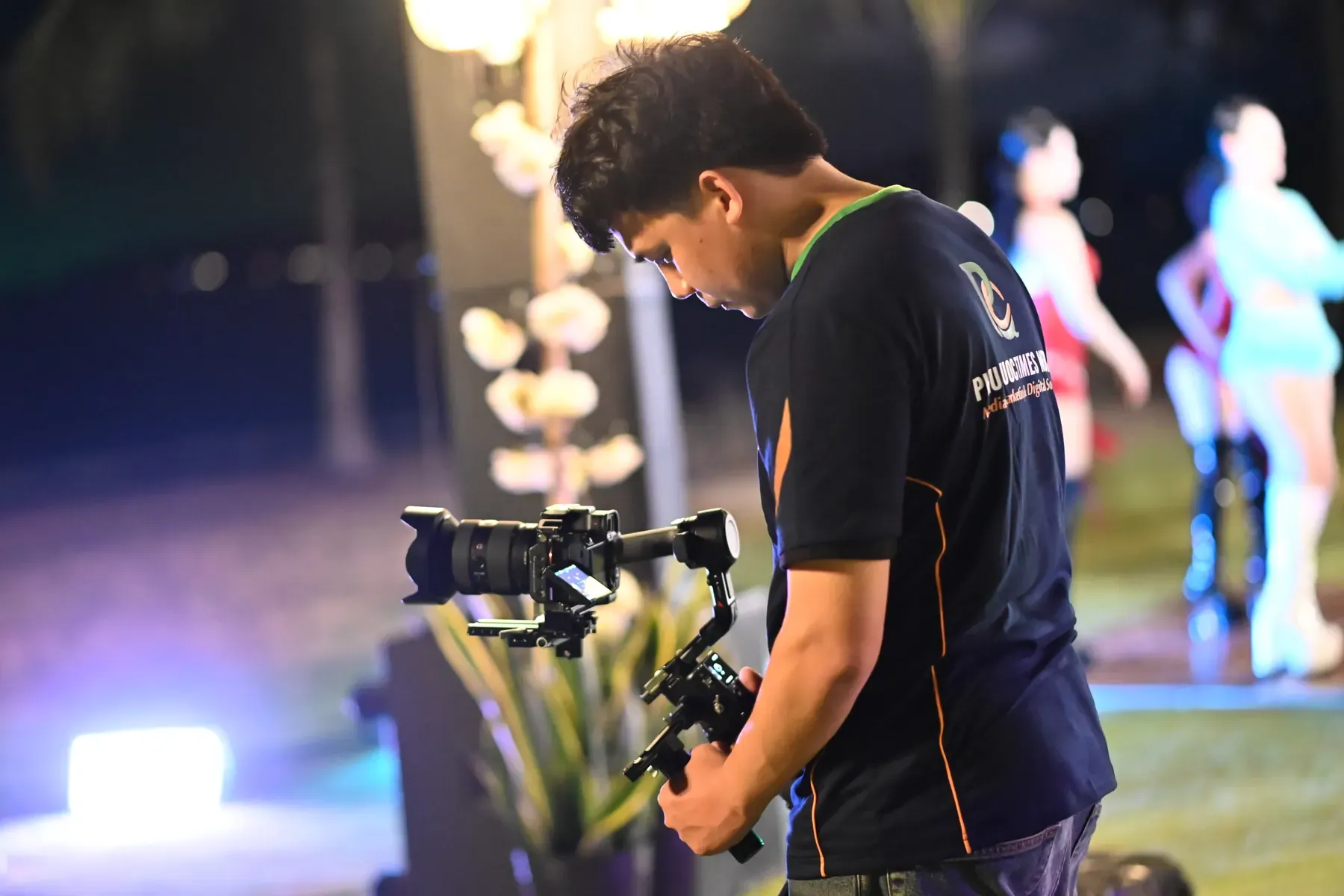 Phu Quoc Times Media filmmaker preparing a camera and stabiliser on location.